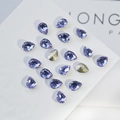 Macro view of teardrop K9 crystals in lavender purple with golden accent details - Water Drop 6x8mm