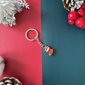 Porte-clés de Noël avec pendentif botte rouge et design festif en métal et alliage - Chaussette de Noël