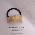 Minimalist gold hammer-textured lava metal charm with black elastic hair tie for women - Curved Asymmetric Side Pleated Gold