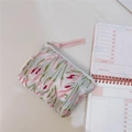 Detailed view of pink tulip embroidery on fabric coin purse with pink braided strap - Green Pink Sprigs