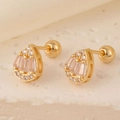 Macro shot of gold teardrop studs with baguette and round zircons and screw ball backs - Gold Baguette Zirconia Teardrop Shape