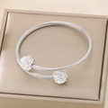 Detail of silver twisted wire steel bangle featuring sparkling rhinestone-inlaid spheres - Steel Color (KB187868-XY)