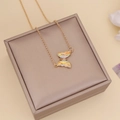 Close-up of golden butterfly necklace with iridescent crystal on jewelry box - 5# Necklace White