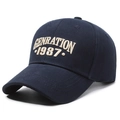 Navy blue cotton baseball cap featuring white GENRATION 1987 embroidery on front - Navy Blue