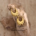 Detailed view of 18K gold chunky hoop earrings with dotted texture on natural stone - Dotted Texture (EH150) / Gold