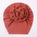 Detailed macro view of the 3D flower decoration on a rib-knit baby turban hat - Wine Red