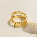 Multi-layer gold spiral ring featuring a green heart-shaped zircon and colorful gemstones - Spiral Heart Arrow / Gold with Green Heart