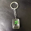 Creative glass keychain with real green four-leaf clover specimen in rectangular resin - Square Four Leaf Clover