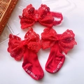 Detailed view of baby red lace bow headband and knitted socks set for newborn photography - Red Lace Bow Set