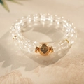 Macro shot of clear quartz crystal bracelet with a gold clover charm and spiral spacers - White Crystal Clover (Includes Exquisite Gift Box) / 8mm Bead Diameter