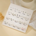 Ensemble élégant de boucles d'oreilles argentées avec perles, étoiles et cœurs - E1947-1