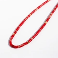 Handmade necklace featuring red cylindrical beads and gold metal spacers on white - Red Imperial Jasper