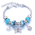 Silver snake chain charm bracelet with turquoise crystal beads and princess crown pendant - Light Blue