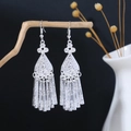 Detailed view of vintage silver alloy tassel earrings with hollow geometric patterns - Silver Retro Tassel Ear Jewelry(E5005-2)