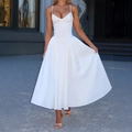 Elegant white spaghetti strap maxi dress with a low-cut waist and flowing skirt - S / White