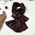 Chic burgundy leather scarf with pleated texture on a modern lifestyle desktop setup - Burgundy