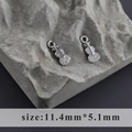 Macro detail of rhodium plated violin pendant with white zircons, size 11.4mm by 5.1mm - Violin Style (M100306)
