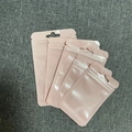 Dettaglio di quattro bustine di plastica rosa richiudibili con chiusura a zip - Rosa (6x10cm)-ai-100 pezzi/confezione