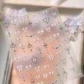 Minimalist M-945 nail art sticker with 3D white bows and blue jewelry pendant designs - Bowknot Chain Style (M-945)