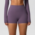 Detail of high-waisted purple yoga shorts and crop top set in breathable elastic fabric - S / Bottoms / Eggplant Purple