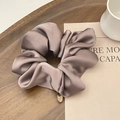 Premium satin scrunchie in dusty mauve color with elegant gold metal charm detail - Gray Purple
