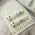 Handmade press-on nails featuring 3D cartoon dog designs with pastel dots and patterns - Cute Dog Paradise