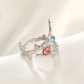 Macro shot of silver hammer-textured branch ring with blue and pink gemstones - AB Zirconia Ring / Silver