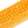 Detailed macro view of yellow cat-eye stone beads in varying sizes for DIY jewelry - 4mm (Approx 90pcs) / Orange