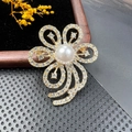 Golden flower brooch with white pearl and sparkling crystals on black velvet - BZ022 Streamline Flower