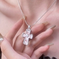 Pink and white cross pendant necklace with silver snake chain worn by a female model - Silver Pink Cross Style (7788)