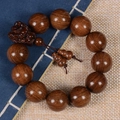 Detailed macro view of sandalwood prayer beads with carved Pixiu and gourd charm - Dragon Head Style / 20mm*12 Beads