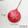 Red metal round Christmas ornament with white snowflakes and double-sided design - Snowflake Ball