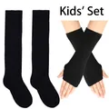 Close-up of kids' black knitted arm warmers and long socks set for dance and warmth - Solid Black