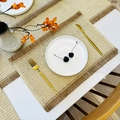 Beige woven paper table mat with decorative brown fringe and textured finish - Jute Fringe Beige