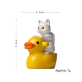 Miniature white cat figurine riding yellow duck, resin garden ornament, 3.2cm tall - White Cat Riding Duck