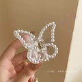 Elegant butterfly hair clip in transparent resin with white pearl edges and metal spring - Pearl Butterfly Hair Claw
