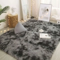 Modern grey tie-dye plush rug for living room displayed on wooden floor with decor - Gradient Dark Gray Shaggy / 50*160cm