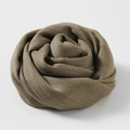 Brown lightweight cotton linen scarf rolled in a decorative flower shape - Dark Khaki