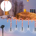 Solar Christmas candy cane outdoor pathway lights with red and white stakes in the snow - Candy Cane Battery Box (5-in-1 Warm White)