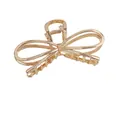 Elegant champagne gold metal bow hair claw clip with a glossy finish for women - Gold