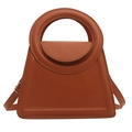 Minimalist brown trapezoid handbag with integrated ring handle and matte leather finish - Brown