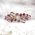 Elegant purple rhinestone bow hair clip with rose gold base for high-end fashion styling - Abundant Flowers / Carmine
