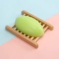 Natural aloe vera handmade milk soap in light green oval shape on a wooden tray - Thai Style Aloe Vera Soap