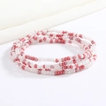 Close-up of handmade multi-layer beaded waist chain in pink and white glass beads - Pearlescent Pink White