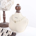 Walnut jewelry organizer stand with pearl necklace and various earrings on a mannequin - Bust Text White Small