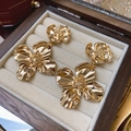 Close-up of golden vintage floral drop earrings on a premium wooden jewelry box tray - Gold (925 Sterling Silver Earring Post)