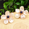 Baroque pearl flower earrings with blue lapis lazuli center on wooden texture - Lapis Lazuli Baroque Pearl (Stainless Steel Base)