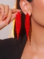 Elegant red rhinestone long tassel earrings for women shown worn on person - Red Bright Rhinestone Tassel