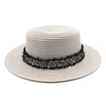 Detail of beige straw boater hat with black fringed ribbon and gold M emblem - M (56-58cm) / Light Gray