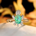 Elegant turtle ring with green opal stone and sparkling white cubic zirconia inlay - Green Synthetic Opal